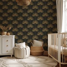 a baby's room with a crib, dresser and wallpaper in black and gold