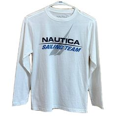 (K339) Show Off Your Little Sailor's Style With This Nautica Sailing Team Long Sleeve T-Shirt. Crafted From 100% Cotton Knit Fabric, This Shirt Features A Crew Neckline And Pullover Closure For Easy Dressing. The Graphic Logo Accents On The Shirt Make It An Everyday Wear For School Or Playtime. It Is Available In Boys' Size 10/12 Medium And Is Perfect For All Seasons. The White T-Shirt Is Machine Washable And Easy To Maintain. The Shirt Is Part Of The Sailing Theme And Is Perfect For Any Boy Who White Nautical Crew Neck Top, White Nautical Tops For Sailing, White Cotton T-shirt For Sailing, Casual White T-shirt For Sailing, Casual White Tops For Sailing, Casual White Top For Sailing, Sailing Theme, Rock The Boat, Nautical Shirt