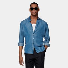 This casual blue shirt is tailored to an extra slim fit and features a small widespread collar, which gives it a more relaxed touch. Blue Slim Fit Shirt With Casual Collar, Light Blue Shirt With Relaxed Fit And Spread Collar, Slim Fit Light Blue Collared Shirt, Light Blue Slim Fit Collared Shirt, Casual Blue Slim Fit Dress Shirt, Blue Slim Fit Casual Shirt, Casual Blue Slim Fit Shirt, Blue Denim Shirt With Spread Collar, Light Blue Slim Fit Top With Spread Collar