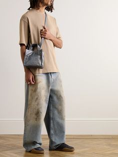 If you frequent the thrift, you've seen jeans like these – washed, smudged, stained – the kind that have endured years of wear. Acne Studios' pair is made to look like the real deal, with marks through the faded front. They're cut from light-blue denim with loose, straight legs and have a classic five-pocket construction. Acne Studios Outfit, Stonewashed Denim Jeans For Streetwear, Streetwear Washed Blue Cotton Jeans, Acne Studios Velocite Jacket, Acne Studios Pants, Acne Studios Jeans, Latest Jeans, Designer Denim, Denim Clothing