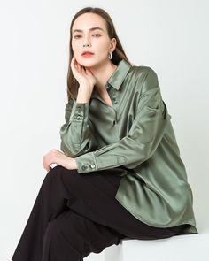 Material: 22 Momme 100% Mulberry SilkModel is wearing a size S and is 174cm, 84cm Bust, 60cm Waist, 90cm Hips; This long-sleeved oversized shirt is made from 100% mulberry silk. With its relaxed silhouette, this silk blouse effortlessly drapes over the body. Designed to be long and slightly loose, it provides versatile styling options. Whether for the office or a spontaneous evening in the city, make this blouse a wardrobe essential, adaptable for various occasions. SIZE: CM / INCH SIZE Bust Sle Long Sleeve Shirt With Button Closure For Fall, Oversized Green Shirt For Fall, Fall Long Sleeve Shirt With Button Closure, Long Sleeve Flannel Shirt With Button Closure, Chic Long Sleeve Winter Shirt, Solid Shirt With Shirttail Hem For Fall, Chic Oversized Long Sleeve Top For Spring, Green Oversized Long Sleeve Shirt, Oversized Green Long Sleeve Shirt