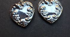 "These are a very sweet pair of sterling silver flowered and scroll embossed heart earrings.   Same on both sides.   Very well crafted. They are marked \"Sterling\".         2.4 grams each.      1 1/4\" long from top of ear wire X 3/4\" wide.  Great for the love of in your life!" Vintage Double Heart Earrings For Anniversary, Classic Silver Double Heart Earrings, Antique Silver Engraved Earrings For Gift, Antique Silver Engraved Earrings Gift, Vintage Sterling Silver Engraved Earrings, Vintage Engraved Sterling Silver Earrings, Vintage Silver Heart Earrings For Valentine's Day, Silver Vintage Heart Earrings For Valentine's Day, Mother's Day Silver Nickel-free Heart Earrings