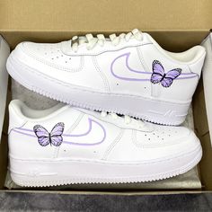 authentic white Nike Air Force 1 custom sneakers hand painted lilac purple lines on the swooshes with 1 butterfly on the outsides of the sneakers on the insides of the sneakers lilac purple lines on the swooshes All sneakers are made on order, please allow the indicated time for your item to be shipped. If you have any questions about the process time or do you need the sneakers quickly? Just send us a message!   * Be aware of your sneaker size, please in doubt go to the store first * Sneakers c Butterfly Shoes Air Forces, Custom Air Force 1 Butterfly And Flowers, Nike Butterfly Shoes Purple, Hand Painted Air Force 1 Purple, Purple Nike Air Shoes, Nike High Tops Double Swoosh Purple, Lilac Nike Air Force 1, Nike Shoes Women Lavender, Butterfly Air Jordans