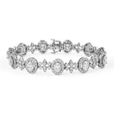 Exquisite and elegant oval diamond and round diamond bracelet. 9.67 carats total gemstone weight. 11 oval diamonds, 4.38 carats. Approximately F/G color and VS2 clarity. Complimented by 246 round brilliant diamonds, 5.29 carats. Approximately G color and VS2 clarity. 18k white gold, 15.08 grams, 6.9 inches.  Accommodated with an up-to-date appraisal by a GIA G.G. once purchased, upon request. Please contact us with any questions. Oval Diamond Bracelet With 17 Jewels, Oval Diamond Bracelets With Diamond Accents, Luxury Oval Diamond White Diamond Bracelet, Luxury Diamond White Oval Diamond Bracelet, Oval Diamond Bracelet For Anniversaries, Oval White Gold Diamond Bracelet With Diamond Accents, Oval Diamond White Bracelet With Diamond Accents, Luxury Oval Tennis Bracelet With Diamond Accents, Fine Jewelry Oval Diamond Bracelet With Accents