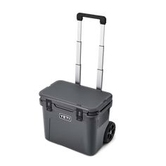 a gray rolling cooler with wheels and handles on the side, against a white background