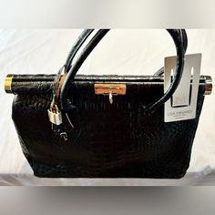 Brand New With Tags / Genuine Leather / Black Croc Embossed / Dual Handle / Includes Crossbody Strap / Fabric Lining / Includes Mini Lock & Key / Interior Zipper Pocket Chic Workwear Bags With Crocodile Pattern, Chic Crocodile Pattern Shoulder Bag For Work, Black Crocodile Pattern Bag For Work, Elegant Crocodile Pattern Shoulder Bag For Work, Black Formal Bag With Crocodile Pattern, Formal Black Crocodile Pattern Shoulder Bag, Black Crocodile Pattern Shoulder Bag For Work, Chic Formal Shoulder Bag With Crocodile Pattern, Chic Formal Crocodile Pattern Shoulder Bag