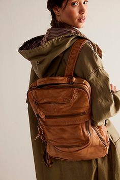 Carry it all in this classically cool leather backpack featured in a slouchy design with exposed zipper pockets and a cracked, distressed finish. * Adjustable straps * Lined interior * Multiple compartments | East End Leather Backpack Bag by FP Collection at Free People in Tan Free People Backpack, Exposed Zipper, Backpack Bag, Distressed Leather, Cute Bags, Leather Backpack, Backpack Bags, Zipper Pocket, Adjustable Straps