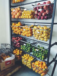 several baskets of fruit are stacked on top of each other