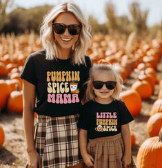 Get ready for the cozy fall season with our adorable Pumpkin Spice Mama and Little Pumpkin Spice matching shirts! This mommy and me set is perfect for pumpkin patch visits, autumn strolls, or just sipping your favorite seasonal latte together. The retro-inspired design features cute pumpkin spice drinks and playful fonts that capture the warm, comforting vibe of fall. Made with soft, high-quality fabric, these shirts ensure comfort for both moms and kids. Available in multiple sizes, this set is Family Matching Black Tops For Fall, Black Family Matching Tops For Fall, Family Matching Short Sleeve Tops For Fall, Family Letter Print Tops For Fall, Fall Tops With Letter Print, Casual Family T-shirt For Fall, Playful Fonts, Pumpkin Spice Drinks, Shirts Cute