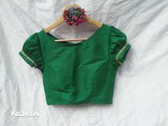 Designer Sari Blouse, Bollywood Blouse, Green Saree Blouse, Crop Top For Women, Ruffle sleeves Bollywood Blouse, Fancy Saree blouse, Blouses Description: Fabric: Banarasi silk Color: Same As Pic Available in every color Green Fitted Top With Gathered Sleeves, Fitted Green Blouse With Gathered Sleeves, Green Blouse With Balloon Sleeves, Fitted Blouse With Balloon Elastic Sleeves, Elegant Green Cotton Blouse, Fitted Green Blouse With Short Sleeves, Green Fitted Blouse With Balloon Sleeves, Fitted Green Short Sleeve Blouse, Fitted Blouse With Gathered Bishop Sleeves