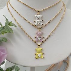 If you are a mama bear, this cute teddy bear necklace is for you! This dainty gold plated necklace is perfect for everyday wear. 💕 ITEM DESCRIPTION: Total length: 14 - 16 - 18 -20 -22  inches. The length of the necklace refers to the total length from end-to-end. Pendant height: 1 inch Pendant width: 0.7 inch Material: 18K Gold Plated Chain - Enamel Bear Charm. Chain color available: Gold. Bear Charm Color Available: Lilac - White - Yellow 💕 GIFT IT Jewelry comes in a cute bag ready to gift! I Cute Jewelry Gift For Mother's Day, Cute Jewelry For Mother's Day Gift, Trendy Gold Charm Necklace For Best Friend, Dainty White Necklace For Best Friend Gift, Cute Mother's Day Charm Necklaces, Bear Design Pendant Jewelry For Gifts, Bear Design Pendant Jewelry As Gift, Charm Necklaces For Best Friend Gift, Bear Design Pendant Jewelry Gift