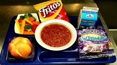 a blue tray topped with lots of food