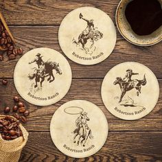 four coasters with the words bourbon barrel and cowboy riding on them next to coffee beans