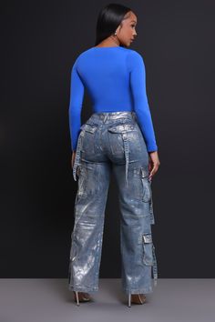 50% Cotton, 27% Polyester, 21% Viscose, 2% Spandex | Inseam: 33" | Model Wearing A Size Medium | Runs True To Size Expect mass hysteria when you step out in these stunning jeans, featuring a high-rise waist with belt loops, zippered closure, and wide cargo leg fit in silver metallic denim with multiple cargo pockets throughout. Jeans With Diamonds, Metallic Denim, Bad Temper, Cargo Jeans, Denim Coat, Wide Leg Denim, Girls Jeans, Bell Bottoms, Boutique Clothing