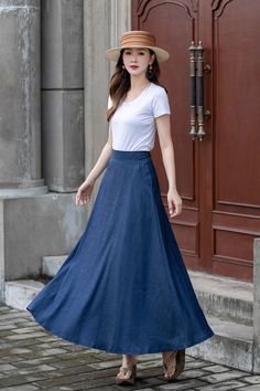 "Introducing our blue A-line high-waisted maxi skirt. This skirt is a timeless and versatile addition to your wardrobe. The A-line silhouette flatters every body shape, while the high-waisted design accentuates your waistline. Made from high-quality fabric, it offers a comfortable fit and effortless style. Whether you dress it up with a blouse and heels or go for a more casual look with a tucked-in t-shirt and sneakers, this skirt is perfect for any occasion. DETAILS: * Tencel blend * Two side pockets * Right zip closure * A litter Back elastic, comfortable wear * Plus size full skirt * Ankel length * Perfect for summer, autumn, spring * Dry clean MODEL SIZE Bust:85 cm(33.4\") Waist:67 cm(26.7\") Height 5'8\" (172cm) She wears size US 2 Choose CUSTOM Order if you * Need a better fit * Can' Non-stretch Maxi Skirt For Spring, Solid Color Dress With Flowy Flared Skirt, Relaxed A-line Maxi Skirt For Spring, Solid Color Long Summer Dress, Flowy Skirt Dress In Solid Color, Fitted A-line Maxi Skirt For Spring, Flowy A-line Maxi Skirt In Solid Color, Summer Full Maxi Skirt, Elegant Non-stretch Maxi Skirt For Spring