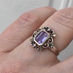 SUPERB VINTAGE MAGNIFICENT VICTORIAN STYLE RING IN STERLING SILVER ADORNED WITH A GENUINE IMPOSING PRINCESS-CUT AMETHYST AND 4 FINE PEARLS. REMARKABLE WORK, VERY ORIGINAL ENGINEERED AND OPEN DESIGN, BEAUTIFUL EFFECT. SPLENDID SPARKLING NATURAL AMETHYST: 7 X 5 mm. WEIGHT: 2.1 gr. HALLMARK: 925. FRENCH SIZE: 54. US SIZE: 6 3/4. IN VERY GOOD SHAPE. BOX NOT INCLUDED. Victorian Style Rings, Victorian Ring, Purple Rings, Victorian Rings, Seed Pearl, Vintage Ring, Victorian Fashion, Vintage Design, Sterling Silver Ring