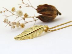 "Nature inspired solid 14k gold feather pendant necklace, beautiful handmade sculptured gold dainty feather charm necklace. This pendant necklace symbolizes nature and love, giving it to your loved one is the classic way to say \"I love you \". It is the perfect valentine's day, wedding, birthday or anniversary gift as it is meaningful and symbolic. This amazing high-quality solid gold necklace is special and original, this is a handmade pendant, design by Sivan Lotan - you will not find it else Gold Feather Jewelry For Wedding, Gold Feathered Wedding Jewelry, Gold Feather Necklace Perfect For Gifting, Gold Feather Necklace For Gift, Gold Necklace With Feathers As A Gift, Gold Necklace With Feathers For Gift, Wedding Necklace Gold, Necklace Gold Pendant, Gold Leaf Pendant