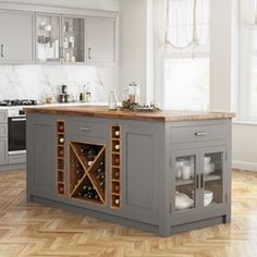 a kitchen island with wine bottles in it