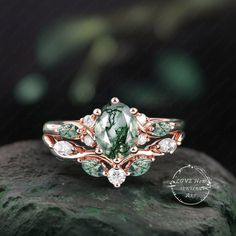 a green ring sitting on top of a rock