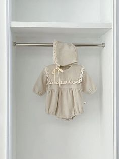 Indulge your little girl in this luxurious Textured Romper with a matching bonnet. Crafted from a soft and textured fabric, the long sleeves and overlay collar provide both elegance and comfort. Adorned with delicate lace trim and buttons in the back, this romper will have your baby girl looking and feeling like a true Textured Fabric, Baby Accessories, Lace Trim, Rompers, Trim, Texture, Collar, Lace