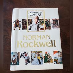 the book cover for norman rockwell's 50 something covers is on a wooden table