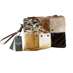 Myra Upcycled Bag New With Tags Wristlet With Leather Handle Calf Hair Patchwork Browns, Cream, Black, Tan Neutral 10.75” L X 7.5”H X 1.5”W Cream Rectangular Clutch For Everyday Use, Cream Rectangular Clutch For Daily Use, Brown Rectangular Wristlet For Everyday Use, Beige Square Clutch For Daily Use, Brown Everyday Rectangular Wristlet, Everyday Brown Rectangular Wristlet, Brown Square Clutch For Daily Use, Cream Rectangular Wristlet For Travel, Brown Adjustable Pouch Wristlet