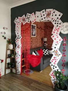 a room decorated with playing cards and decorations