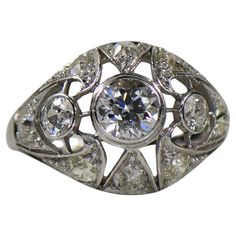 an antique style diamond ring with diamonds on it