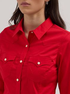 CLASSIC AND ICONIC You’ll look sharp and ready to conquer the world in our Women’s Wrangler Retro® Western Button-Down Shirt. It’s crafted from a comfortable cotton blend with just a hint of stretch. It comes with our signature chest flap pockets and “W” stitching as well as Western yokes, a pointed collar, and a full button closure for easy layering. Get one for every day of the week. Western Style Cotton Workwear Tops, Red Western Style Tops For Ranch, Cotton Tops With Buttons For Rodeo, Cotton Tops With Snap Buttons For Rodeo, Red Shirt Outfits, Western Shirts For Women, Conquer The World, Retro Western, Red Jeans