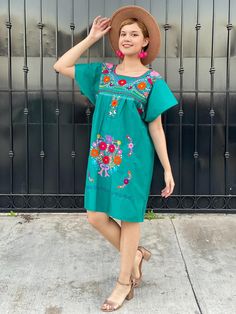 "Teal embroidered mexican dress, LARGE boho tunic, fiesta san antonio outfit, colorful sundress, festival clothing, flower lovers gift, coco A very bright and fun traditional Mexican dress, short sleeve, teal and multicolor hand embroidered flowers. Great piece to wear in spring, summer, mexican festivities or if you go to a Mexico destination vacay. Loose fit Made of Cotton Fits size LARGE Measurements taken flat: - Armpit to armpit 22 1/2\" - Bottom hem width 24 3/4\" - Shoulder to bottom hem Green Bohemian Embroidered Dress For Spring, Green Bohemian Embroidered Spring Dress, Green Casual Embroidered Summer Dress, Casual Green Embroidered Summer Dress, Spring Hippie Floral Embroidery Dresses, Multicolor Embroidered Dress For Cinco De Mayo, Spring Fiesta Folk Style Embroidered Dress, Green Folk Dress For Summer, Green Folk Style Summer Dress