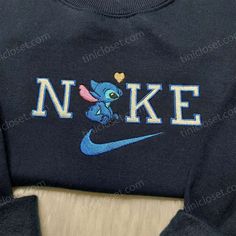 Introducing the Nike Stitch Love Embroidered Sweatshirt, a perfect blend of comfort and style. This hoodie features a stunning Lilo Blue Crew Neck Hoodie With Embroidered Graphics, Blue Embroidered Crew Neck Hoodie, Cute Hooded Tops With Embroidered Logo, Cute Hooded Top With Embroidered Logo, Cute Hooded Sweatshirt With Embroidered Graphics, Cute Embroidered Long Sleeve Hoodie, Blue Embroidered Fleece Sweatshirt, Cute Hooded Sweatshirt With Custom Embroidery, Cute Hooded Tops With Embroidered Graphics