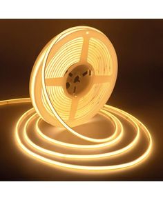 a roll of white led tape on a dark background with the light coming from it's end