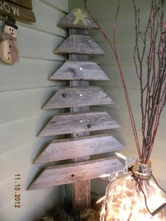 a christmas tree made out of wooden planks