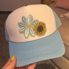 Light Blue Patched Unisex Trucker Hat With Sunflower And Daisy Summer Blue Snapback Trucker Hat, Blue Snapback Trucker Hat For Summer, Blue Summer Trucker Hat, Blue Curved Brim Trucker Hat For Summer, Summer Blue Adjustable Trucker Hat, Trendy Blue Trucker Hat For Vacation, Blue Adjustable Summer Trucker Hat, Blue Adjustable Trucker Hat For Summer, Adjustable Blue Trucker Hat For Summer