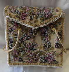 This quality vintage An Original By Midas basket purse is slightly used in good condition. White painted wicker basket base with a floral beaded embroidery design  Closing Clasp, lining and leather strap all in good condition. This purse measures 11.5"inches high, 11" inches wide and 5" inches depth. We do our best to take live, clear and as many pictures as possible to guarantee what you see is what you will receive. Any issues with the purchased product(s) must be communicated within 3 days of Handmade Vintage Straw Bag, Handmade Vintage Straw Basket Bag, Vintage Woven Basket Bag, Vintage Handwoven Basket Bag, Vintage Handwoven Straw Bag, Paint Wicker Basket, Basket Purse, Painted Wicker, Vintage Handbag