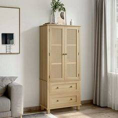 a living room with a couch and a cabinet