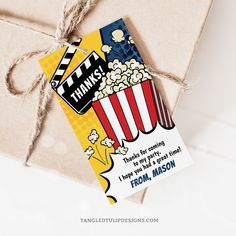 a gift wrapped in brown paper with a tag attached to it that says thank you for watching the movie