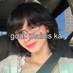 a woman wearing glasses sitting in a car with the words goal maine ka above her head