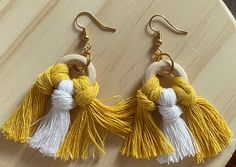 Handmade macrame earrings in yellow & white Yellow Dangle Jewelry With Tassels, Yellow Tassel Earrings As Gift, Yellow Bohemian Tassel Earrings, Yellow Bohemian Adjustable Tassel Earrings, Adjustable Yellow Bohemian Tassel Earrings, Bohemian Yellow Adjustable Tassel Earrings, Handmade White Tassel Earrings For Beach, Handmade Yellow Dangle Tassel Earrings, Adjustable Yellow Macrame Jewelry