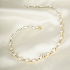 You cannot go wrong with pearls and diamonds, can you? This necklace here is crafted in gold to sit cozily on the nape of your neck, with intermittently placed pearls pierced with diamonds. split Gold(14K) : 15.29g Diamonds : (VS clarity & H-I colour) : (Brilliant cut ) : 0.71ct Gemstone : Chinese Cultured Pearl Silver Alloy split Pearls and diamonds are a match made in heaven! Pair this necklace with your everyday formals or your pastels and you're making an elegant style statement! Classic Baguette Cut Diamond Necklace For Formal Occasions, Formal Cubic Zirconia Diamond Necklace With Baguette Cut, Luxury White Diamond Necklace With Polished Finish, Evening Jewelry With Vvs Clarity And Round Cut, Evening Jewelry With Vvs Clarity, Elegant White Gold Baguette Cut Necklace, Elegant Hallmarked Diamond Necklace For Formal Occasions, Luxury High Luster Necklaces For Formal Occasions, Formal Diamond White Necklace With Polished Finish