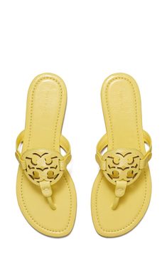 A cutout logo medallion offers signature charm atop a leather flip-flop secured with a center toe post. Leather upper and lining/rubber sole Imported White Tory Burch Sandals, Tory Burch Sandals Sparkly, Tory Burch Sandal, Tory Burch Charm Mules, Tory Burch Miller Sandals Black, Yellow Tory Burch Sandals, Yellow Sandals, Pretty Sneakers, Punk Boots