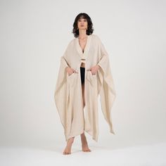 Size: One Size Fits Most. Step up your beach attire with our Elaine Beige Linen Kimono & Beach Cover-Up. Crafted from linen, it's perfect for relaxing or taking a stroll along the shore. The versatile beige color complements any outfit, while the loose fit accommodates most body types. Featuring a stylish V-neck design, long sleeves, and pockets on each side, this kimono offers both style and practicality. With its easy button closure, it's a breeze to slip on over your swimsuit for quick coverage. Whether you're lounging by the water or exploring the coastline, our Elaine Beige Linen Kimono & Beach Cover-Up is the perfect choice for effortless beach chic. Linen Cover-up For Spring Vacation, Bohemian Linen Cover-up For Spring, Spring Bohemian Linen Cover-up, Linen Beachwear Cover-up For Spring, Bohemian Linen Beach Cover-up, Bohemian Linen Cover-up For Vacation, Cotton Wrap Beach Cover-up, Cotton Wrap Cover-up For Beach, Summer Beige Loungewear Cover-up