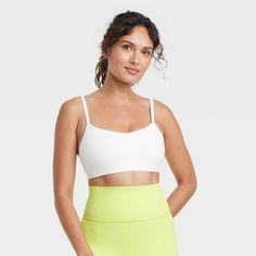 Women's Everyday Soft Light Support Strappy Sports Bra - All In Motion™ Cream M Summer Compressive Light Support Sports Bra, Summer Compression Sports Bra With Light Support, Light Support Sports Bra For Summer Activities, White Sports Bra With Medium Support For Summer, Summer Sports Bra With Light Support For Light Sports, Seamless Sports Bra For Light Sports In Summer, Seamless Nylon Sports Bra With Athletic Fit, Functional Sports Bra For Light Sports In Summer, Summer Light Support Nylon Sports Bra