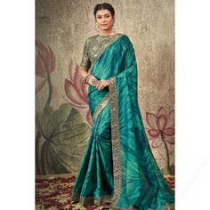 Created specifically for fashion elites, this peacock blue satin saree will definitely make others envious of your look. This round neck and half sleeve blouse is embellished in lace and printed work. It is set together with a satin light weight saree in peacock blue color highlighted with foil print and lace work. This blouse can be customized up to the maximum size available in inches 44 around the bust. Slight color variation may occur due to photographic reasons. Blue Satin Saree, Zari Work Saree, Celebrity Gowns, Brocade Blouses