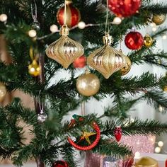 a christmas tree with ornaments hanging from it