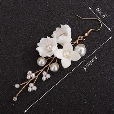 Bridal and bridesmaids white ceramic flower bouquet on a silver or gold twisted wire with multiple flexible branches and round white pearl earrings. Wedding twisted wire floral jewelry Sweet and tender white life like ceramic flowerheads with multiple pearl beads and twisted wire branches make these beautiful bridal earrings. The elegant midsize 3.2"L earrings can be customized and made into studs or ear clips. Versatile and chic, the wedding style earrings will be a nice addition to a bridal ou Pearl Bridesmaid Jewelry, Earring Bridal, Beach Jewelry Boho, Bridal Jewelry Necklace, Trendy Bride, Pearl Earrings Wedding, Flower Ear, White Pearl Earring, Flower Earring