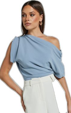 Spring Tops With Asymmetrical Neckline In Solid Color, Blue Asymmetrical Blouse, Trendy Light Blue Party Top, Trendy Light Blue Top For Party, Asymmetrical Blue Blouse For Work, Trendy Blue Tops With Asymmetrical Hem, Plain Tops For Evening In Spring, Asymmetrical Blue Blouse For Workwear, Blue Trendy Tops With Asymmetrical Hem