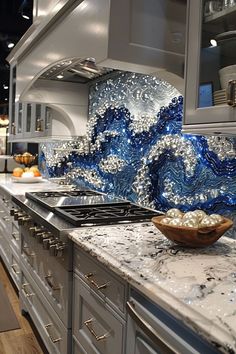 a blue and white kitchen with marble counter tops