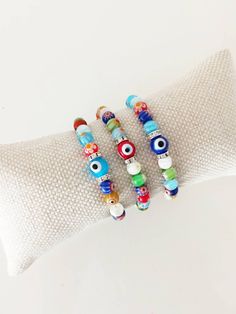 ⭐️The millefiori beads on the stretch bracelets are made of glass. ⭐️These Italian Floral beaded bracelets include multicolored Millefiori beads with glass evil eye. ⭐️This Millefiori Stretch Bracelet with Evil eye charm would be the perfect gift as a protection amulet. For more evil eye bracelets, click the link below; https://www.etsy.com/shop/EyeDesignsbyGG?ref=search_shop_redirect&section_id=30219689 Multicolor Evil Eye Friendship Bracelets With Round Beads, Spiritual Multicolor Beaded Bracelets With Evil Eye, Spiritual Multicolor Stretch Bracelet With Spacer Beads, Multicolor Beaded Bracelets With Evil Eye, Bohemian Multicolor Round Beads Evil Eye Bracelet, Multicolor Evil Eye Bracelet With Colorful Round Beads, Multicolor Evil Eye Friendship Bracelets, Bohemian Style Multicolor Beaded Evil Eye Bracelet, Adjustable Multicolor Evil Eye Bracelet With 8mm Beads