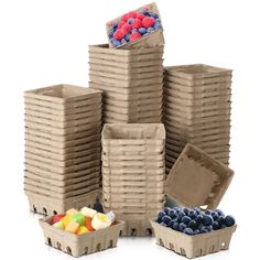 several cardboard boxes filled with different types of fruits and vegetables, all stacked on top of each other